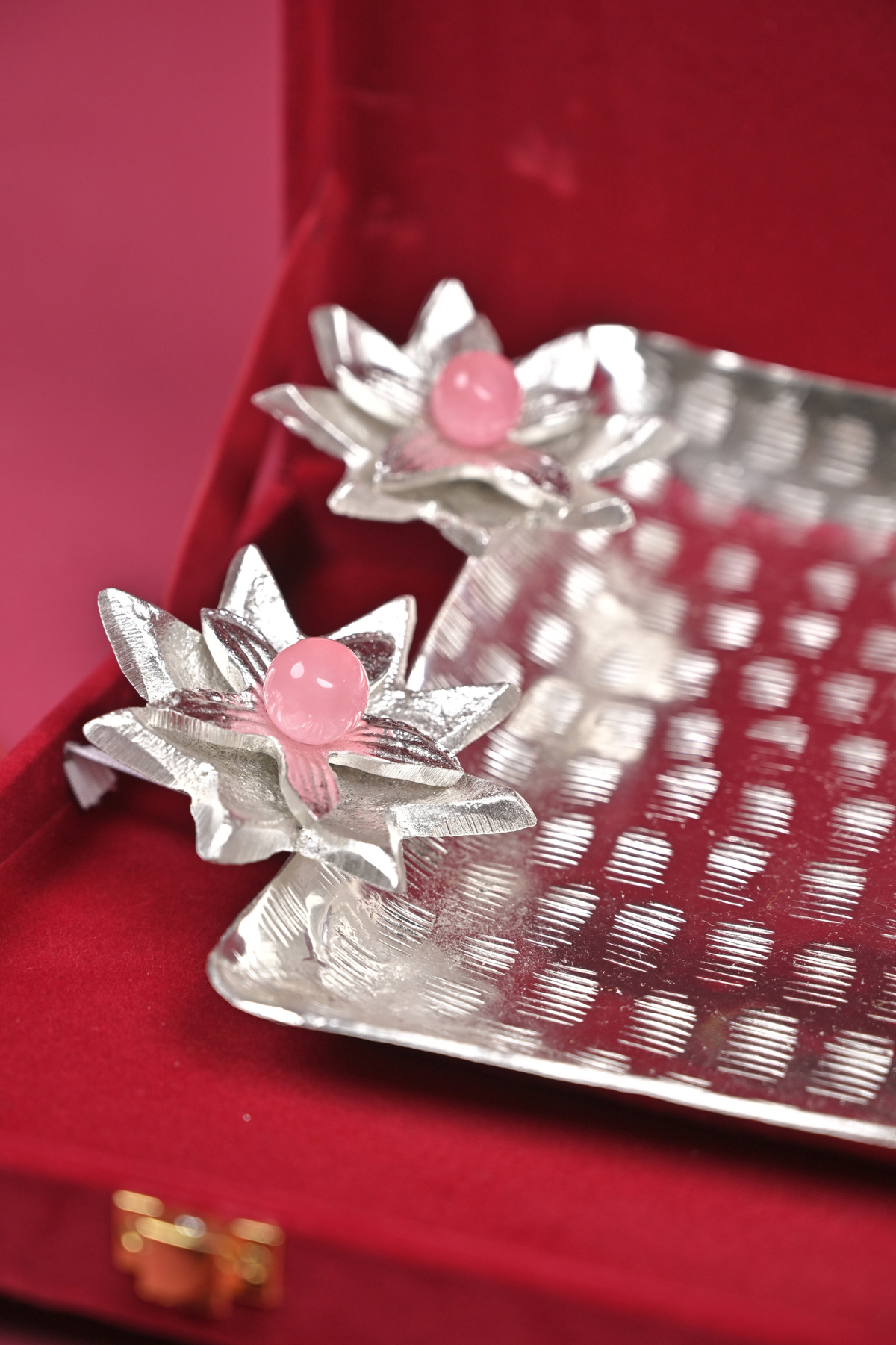 silver floral serving tray with lotus diyas