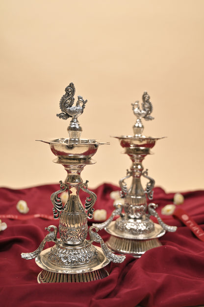 German Silver Peacock Samayi Diya Pair with Ornamental Base – Traditional Oil Lamps for Pooja & Décor