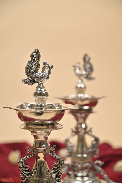 German Silver Peacock Samayi Diya Pair with Ornamental Base – Traditional Oil Lamps for Pooja & Décor