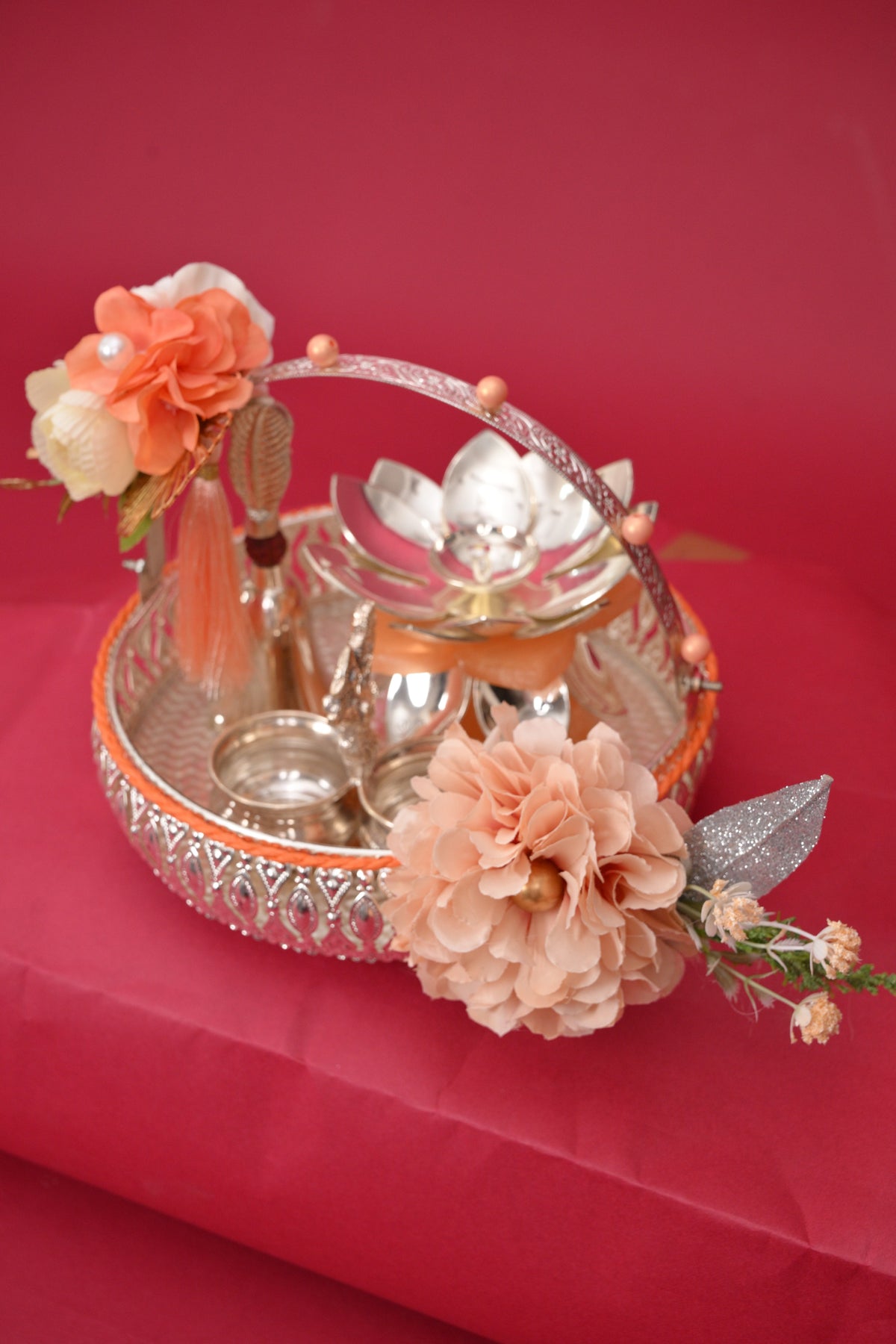 decorative gift basket with diya & silver bowls