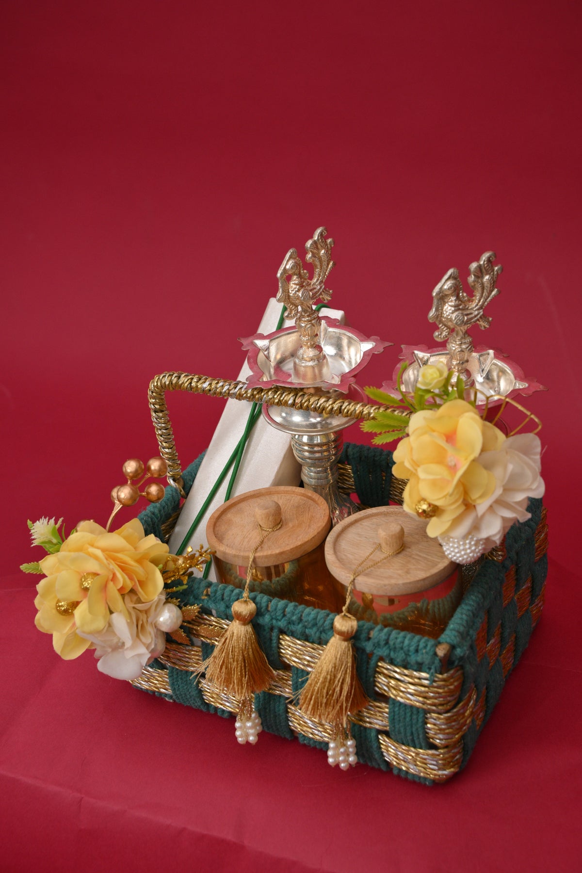 decorative gift basket with diyas & wooden jars