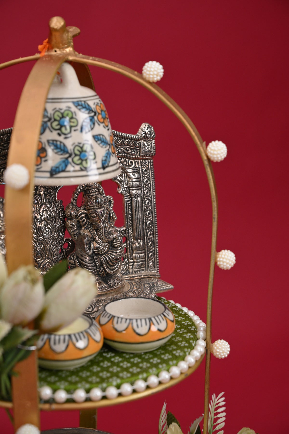 three-tier pooja decor stand with idols & bell