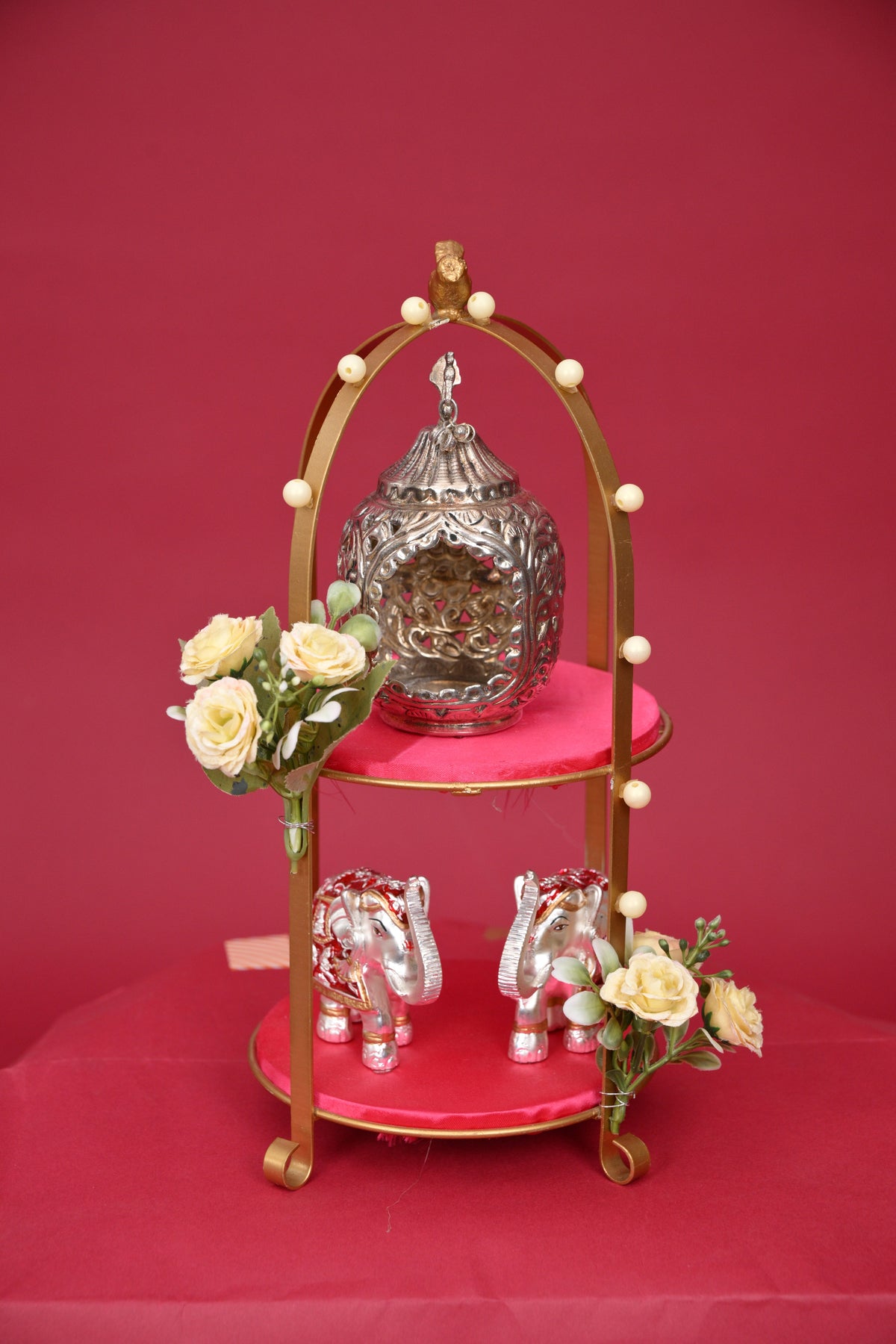 two-tier decorative pooja stand with ganesha & diyas