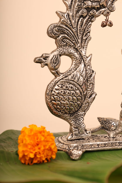 Radha Krishna with Bells and Peacock Frame – Handcrafted German Silver Wall Decor for Temple & Home